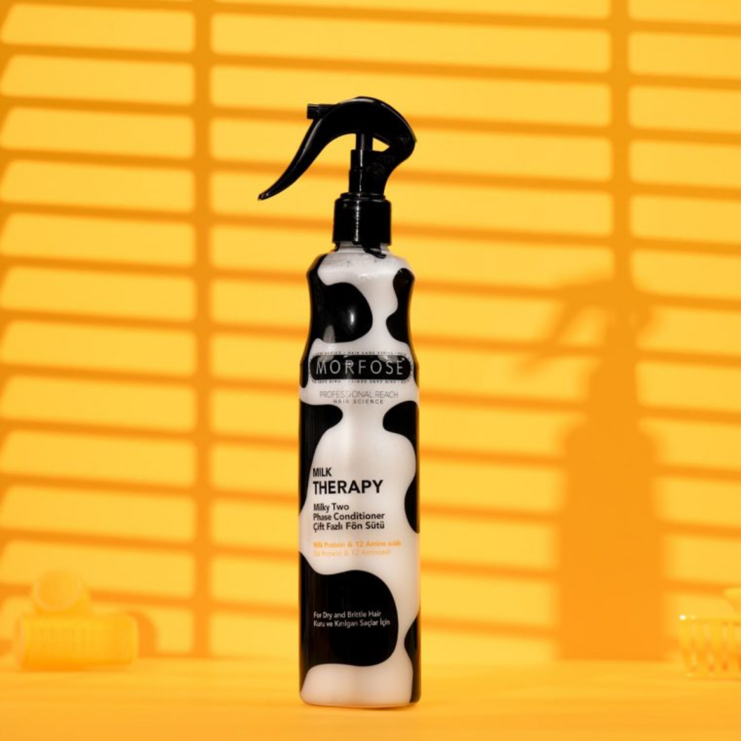 Morfose Milk Therapy conditioner bottle on a yellow background